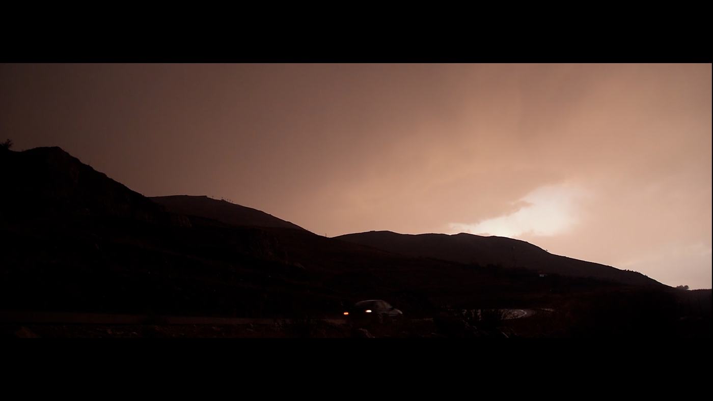 A face half lost in red light (6/10)